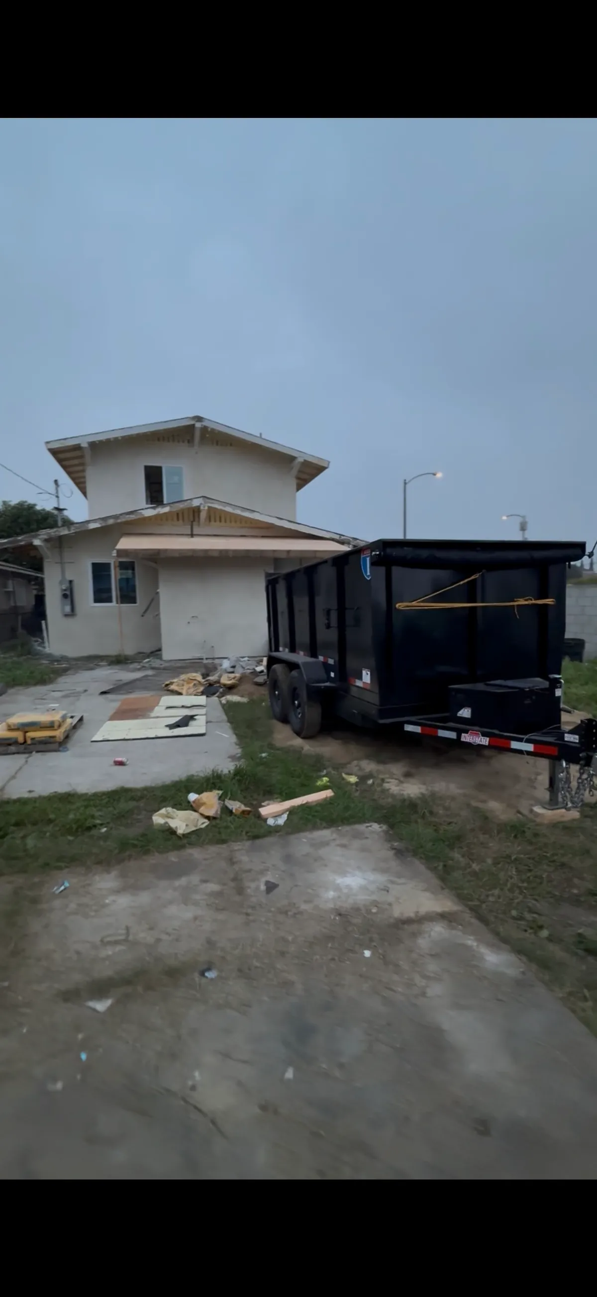Junk Mint 12-Yard Dumpster Trailer on Jobsite
